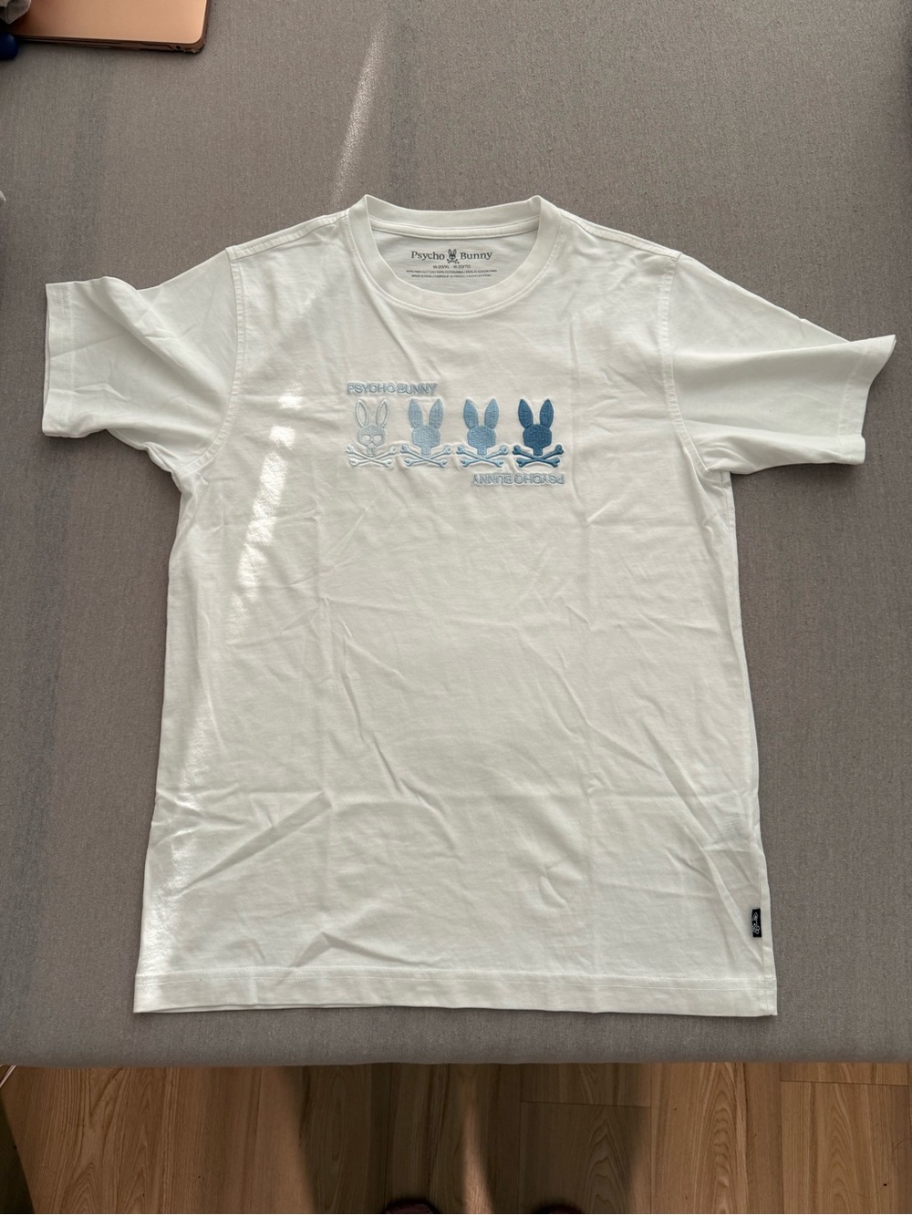 Psycho Bunny White Short Sleeve Tee with Blue Bunny Row Graphic